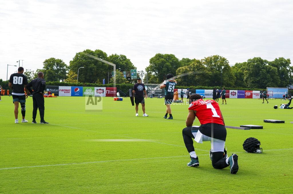 Chris Szagola Philadelphia Eagles' Jalen Hurts, right, kneels before taking the field during the NFL football team's training camp, Wednesday, July 27, 2022, in Philadelphia. (AP Photo/Chris Szagola)