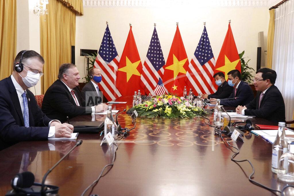 Bui Lam Khanh U.S. Secretary of State Mike Pompeo, second from left, and Vietnamese Foreign Minister Pham Binh Minh, right, attend a meeting in Hanoi, Vietnam, Friday, Oct. 30, 2020. Pompeo is wrapping up an anti-China tour of Asia in Vietnam as the fierce American presidential election race enters its final stretch. (Bui Lam Khanh/VNA via AP)