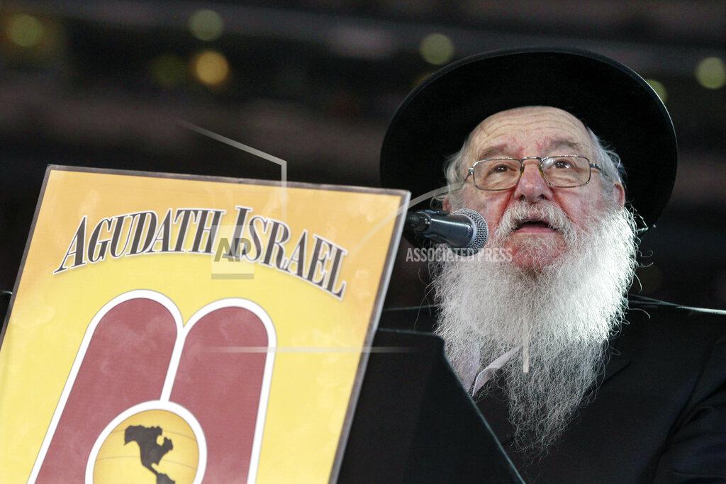 Mel Evans FILE - In this Wednesday, Aug. 1, 2012 file photo, Rabbi Yaakov Perlow addresses Orthodox Jews at MetLife stadium in East Rutherford, N.J, during the Siyum HaShas celebration which marks the completion of the Daf Yomi, or daily reading and study of one page of the 2,711 page book. The cycle takes about 7½ years to finish. Perlow died on April 7, 2020 of complications arising from COVID-19, shortly after urging Orthodox Jews to follow social distancing guidelines. He was 89. (AP Photo/Mel Evans)