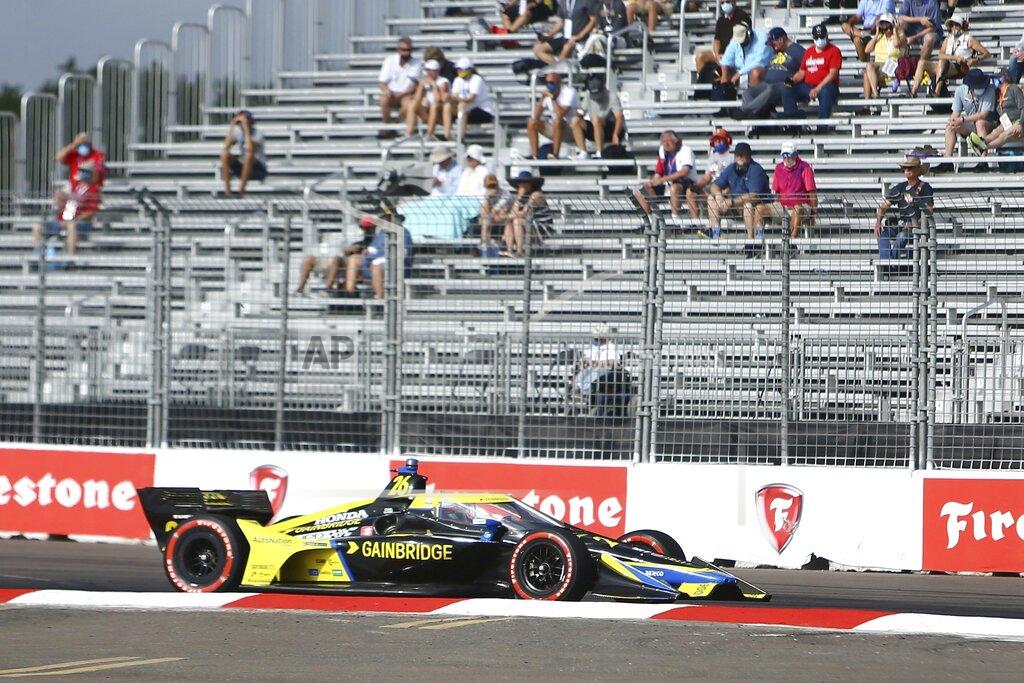 Luis Santana Pole sitter Colton Hereta (26) rounds turn one during the morning practice before the start of the Grand Prix of St. Petersburg auto race, Sunday, April 25, 2021 in St. Petersburg, Fla. (Luis Santana/Tampa Bay Times via AP)