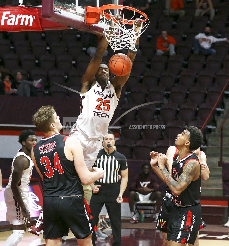 Matt Gentry Virginia Tech's Justyn Mutts (25) scores past the VMI defense during the second half of an NCAA college basketball game, Thursday, Dec. 3, 2020 in Blacksburg, Va. (Matt Gentry/The Roanoke Times via AP, Pool)