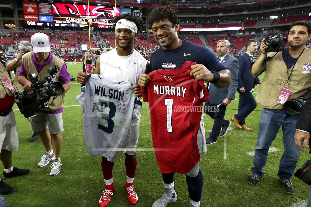 Ross D. Franklin Seattle Seahawks quarterback Russell Wilson, right, and Arizona Cardinals quarterback Kyler Murray, left, exchange jerseys after an NFL football game, Sunday, Sept. 29, 2019, in Glendale, Ariz. (AP Photo/Ross D. Franklin)