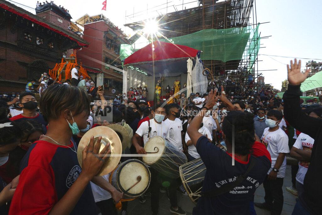 Niranjan Shrestha Devotees play traditional drums during the annual Indra Jatra festival in Kathmandu, Nepal, Sunday, Sept. 19, 2021. The feast of Indra Jatra marks the return of the festival season in the Himalayan nation two years after it was scaled down because the pandemic. (AP Photo/Niranjan Shrestha)