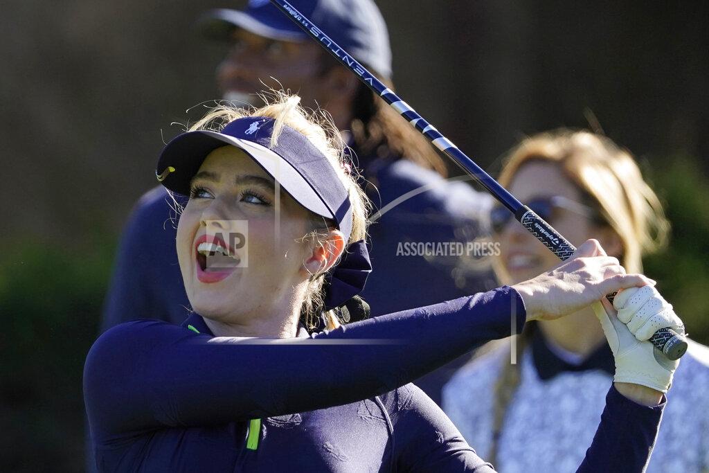 Eric Risberg Kathryn Newton follows her drive from the first tee during the charity challenge event of the AT&T Pebble Beach Pro-Am golf tournament Wednesday, Feb. 10, 2021, in Pebble Beach, Calif. In the background are Larry Fitzgerald and Kira K. Dixon. (AP Photo/Eric Risberg)