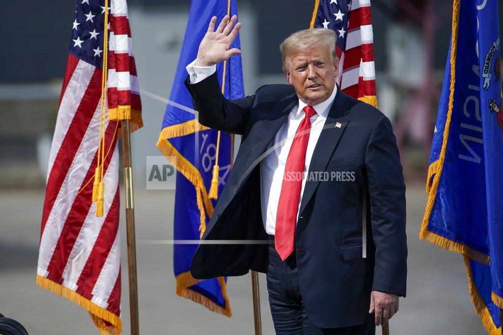 Morry Gash President Donald Trump leaves the stage after speaking at an event at Fincantieri Marinette Marine, Thursday, June 25, 2020, in Marinette, Wis. (AP Photo/Morry Gash)