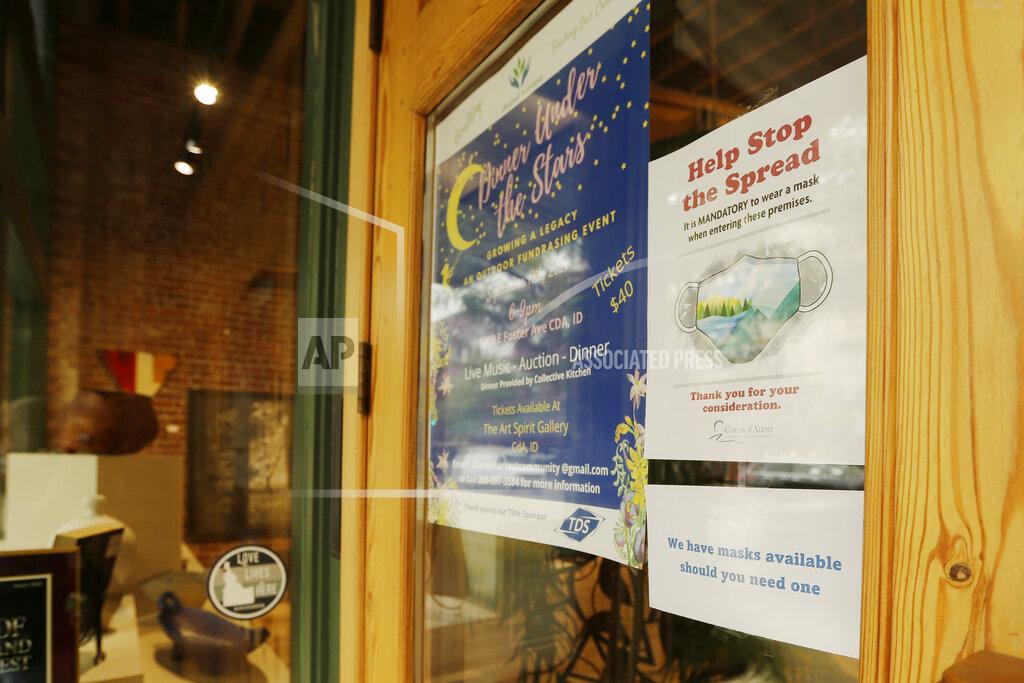 Young Kwak A mandatory mask usage sign is displayed at Art Spirit Gallery, Friday, Sept. 10, 2021, in Coeur d'Alene, Idaho. Northern Idaho has a long and deep streak of antigovernment activism that is confounding attempts to battle a COVID-19 outbreak. (AP Photo/Young Kwak)