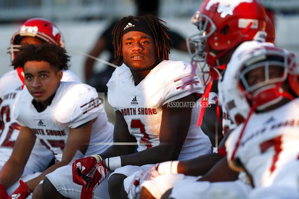 Tim Warner In this Dec. 7, 2019 photo, North Shore Mustangs running back Zachary Evans (3) and teammates watch from the bench induringthe fourth quarter during the second half of the high school football playoff game against the Atascocita Eagles at Sheldon ISD Panther Stadium in Houston, Texas. The talented running back from Houston quietly signed with Georgia in December, but was later released from his national letter of intent by the Bulldogs. (Tim Warner/Houston Chronicle via AP)
