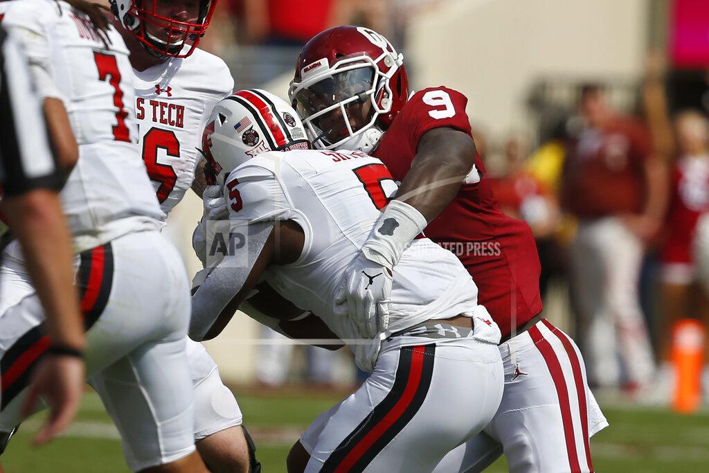 Sue Ogrocki Oklahoma linebacker Kenneth Murray (9) tackles Texas Tech running back Armand Shyne (5) in the second quarter of an NCAA college football game in Norman, Okla., Saturday, Sept. 28, 2019. (AP Photo/Sue Ogrocki)