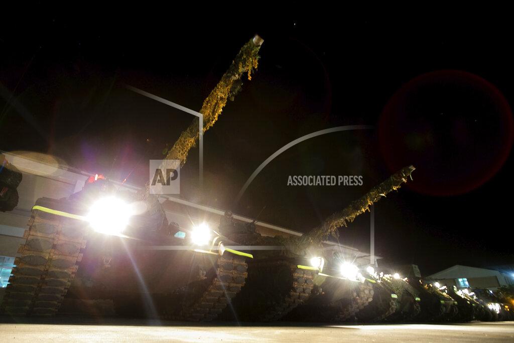 Uncredited In this photo released by the Military News Agency, tanks prepare for the annual Han Kuang live-fire drills in Hualian, eastern Taiwan in the early hours of Tuesday, Sept. 14, 2021. (Military News Agency via AP)