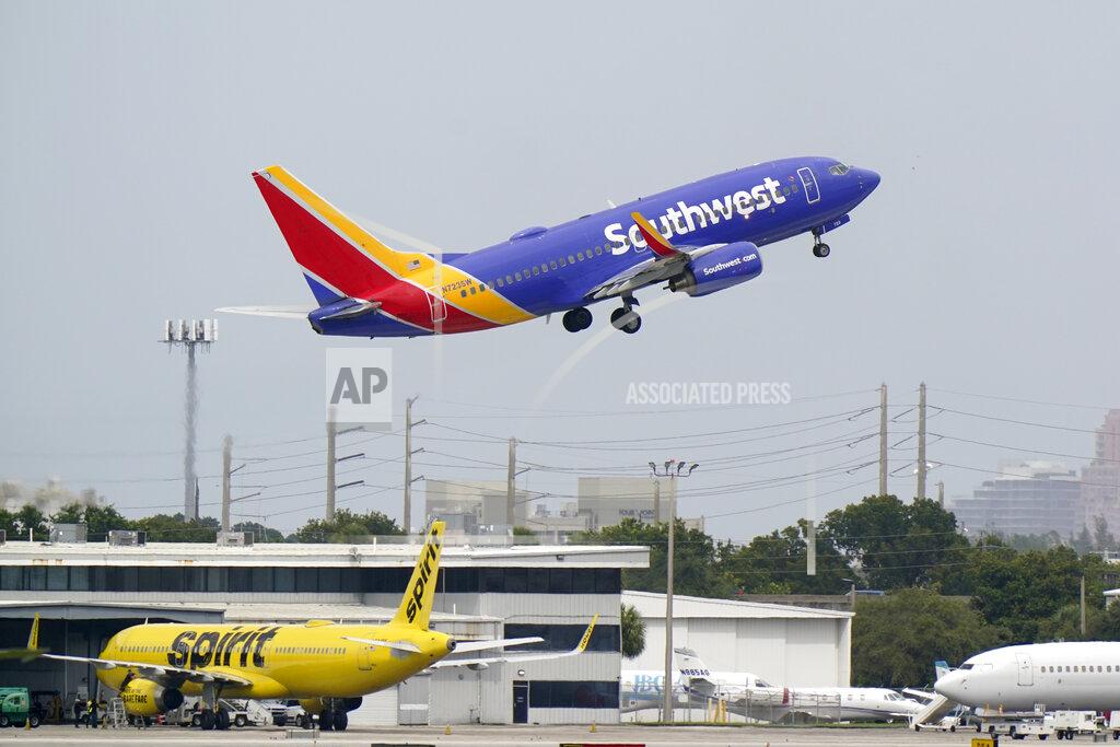 FILE - In this Oct. 20, 2020, file photo, a Southwest Airlines Boeing 737-7H4 takes off from Fort Lauderdale-Hollywood International Airport in Fort Lauderdale, Fla. Southwest Airlines expects travel demand to remain depressed in early 2021. Southwest CEO Gary Kelly said Thursday, Nov. 19, that means his airline will have a lot more planes than it needs. (AP Photo/Wilfredo Lee, File)