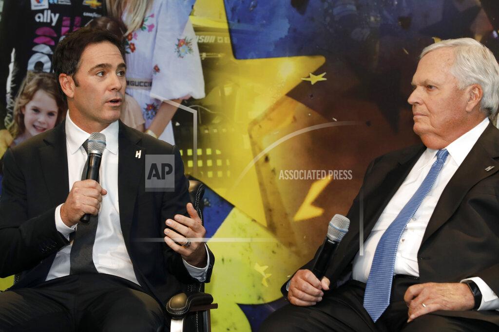 Bob Leverone Jimmie Johnson, left, looks to team owner Rick Hendrick as he answers a reporter's question during his NASCAR retirement announcement at Hendrick Motorsports near Charlotte, N.C., Thursday, Nov. 21, 2019. (AP Photo/Bob Leverone)