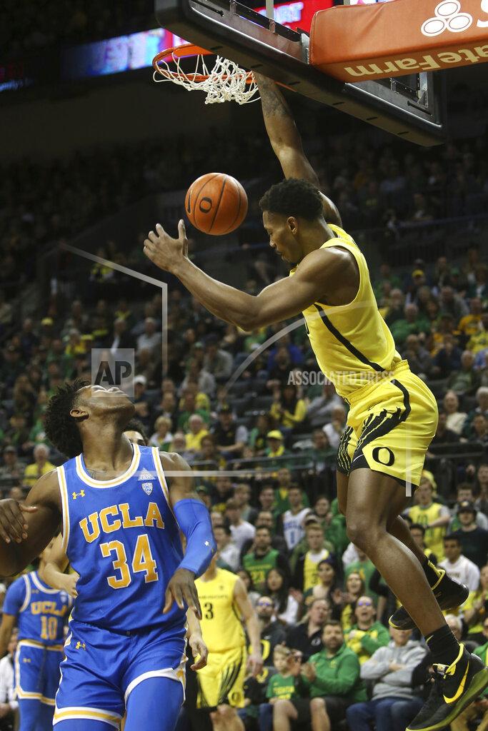Chris Pietsch Oregon's Shakur Juiston, right, dunks the ball over UCLA's David Singleton during the first half of an NCAA college basketball game in Eugene, Ore., Sunday, Jan. 26, 2020. (AP Photo/Chris Pietsch)