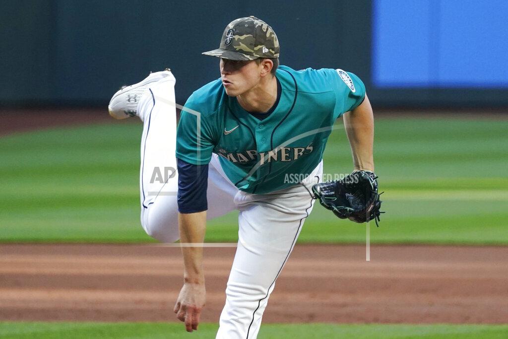 Elaine Thompson Seattle Mariners starting pitcher Chris Flexen follows through as he throws against the Cleveland Indians in the first inning of a baseball game Friday, May 14, 2021, in Seattle. (AP Photo/Elaine Thompson)