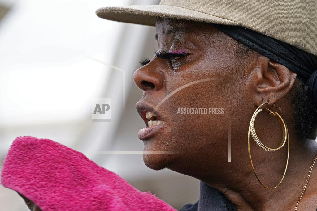 Gerald Herbert Rakisha Murray cries in relief as she arrives to see her mother's home largely undamaged, after she returned from evacuation with her mother and other family in Lake Charles, La., in the aftermath of Hurricane Laura, Sunday, Aug. 30, 2020. (AP Photo/Gerald Herbert)
