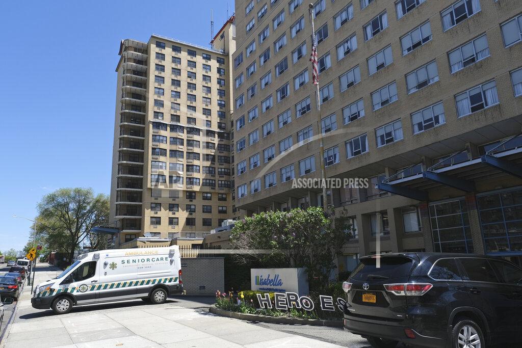 Seth Wenig FILE - In this May 5, 2020, file photo an ambulance leaves the Isabella Center in New York. A report from Senate Democrats finds that the Trump administration was slow to comprehend the scale of COVID-19's impact on nursing homes and a disjointed federal response only compounded the devastating toll. (AP Photo/Seth Wenig, File)