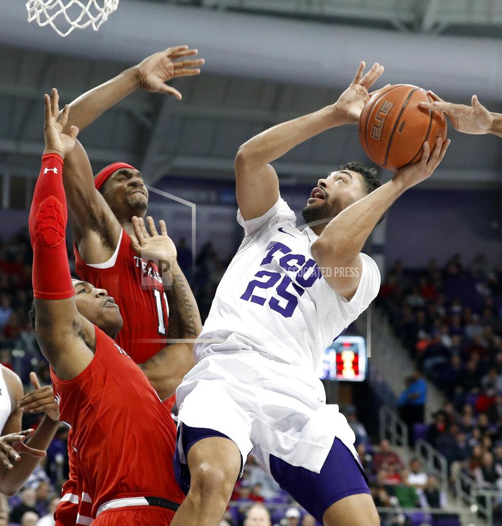 Tony Gutierrez TCU guard Alex Robinson (25) struggles to get a shot off as Texas Tech Deshawn Corprew, bottom left, and Tariq Owens (11) defend in the second half of an NCAA college basketball game in Fort Worth, Texas, Saturday, March 2, 2019. (AP Photo/Tony Gutierrez)