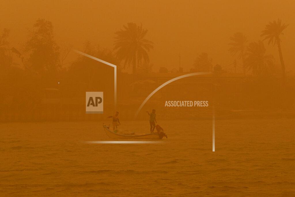 Nabil Al-Jurani Fishermen navigate on the Shatt al-Arab waterway during a sandstorm in Basra, Iraq, Monday, May 23, 2022. (AP Photo/Nabil al-Jurani)