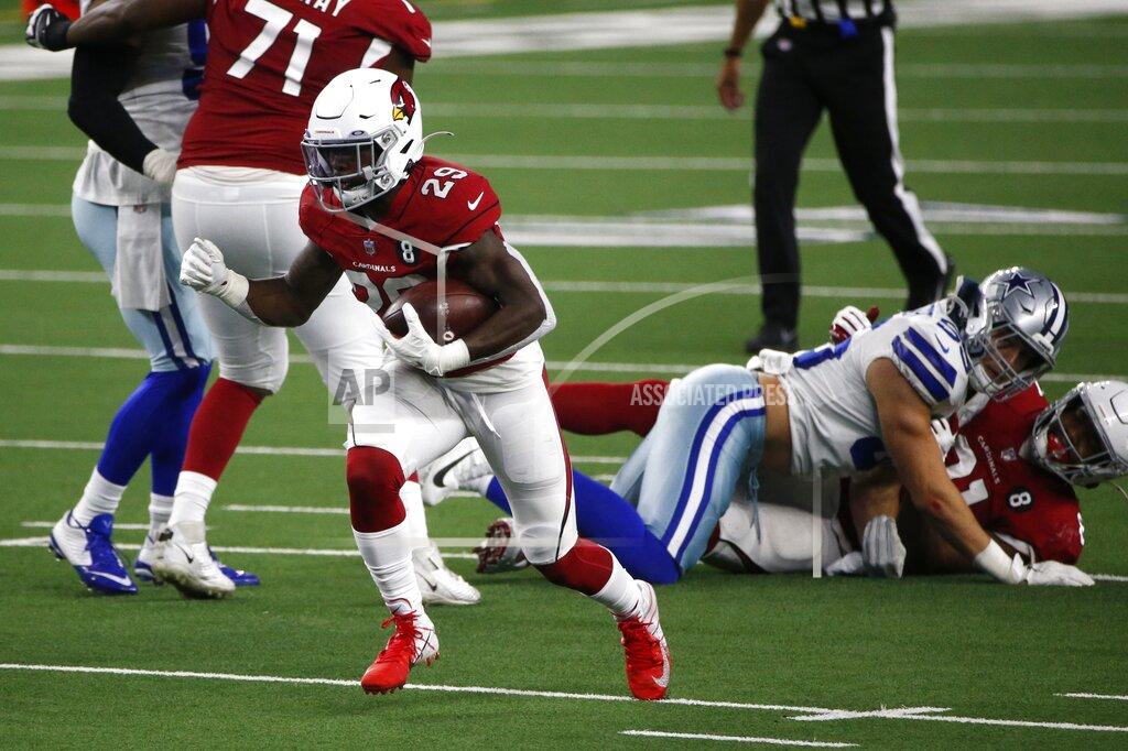 Michael Ainsworth Arizona Cardinals running back Chase Edmonds (29) breaks through the line for a short gain in the second half of an NFL football game against the Dallas Cowboys in Arlington, Texas, Monday, Oct. 19, 2020. (AP Photo/Michael Ainsworth)