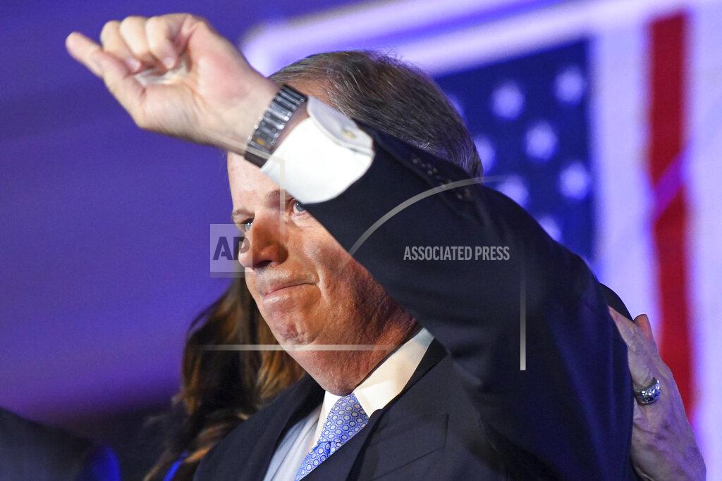 Julie Bennett FILE - In this Nov. 3, 2020 file photo, Sen. Doug Jones, D-Alabama, gestures during his concession speech in Birmingham, Ala. Jones lost to Republican Tommy Tuberville. (AP Photo/Julie Bennett, File)