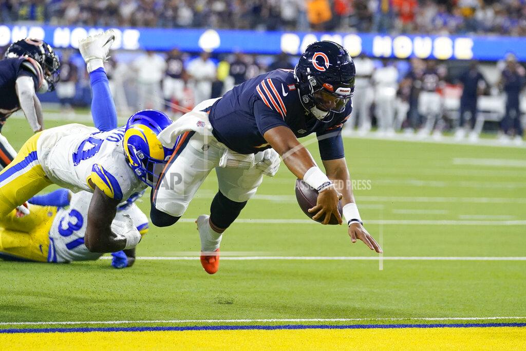 Chicago Bears quarterback Justin Fields scores a touchdown during the second half of an NFL football game against the Los Angeles Rams, Sunday, Sept. 12, 2021, in Inglewood, Calif. (AP Photo/Marcio Jose Sanchez)