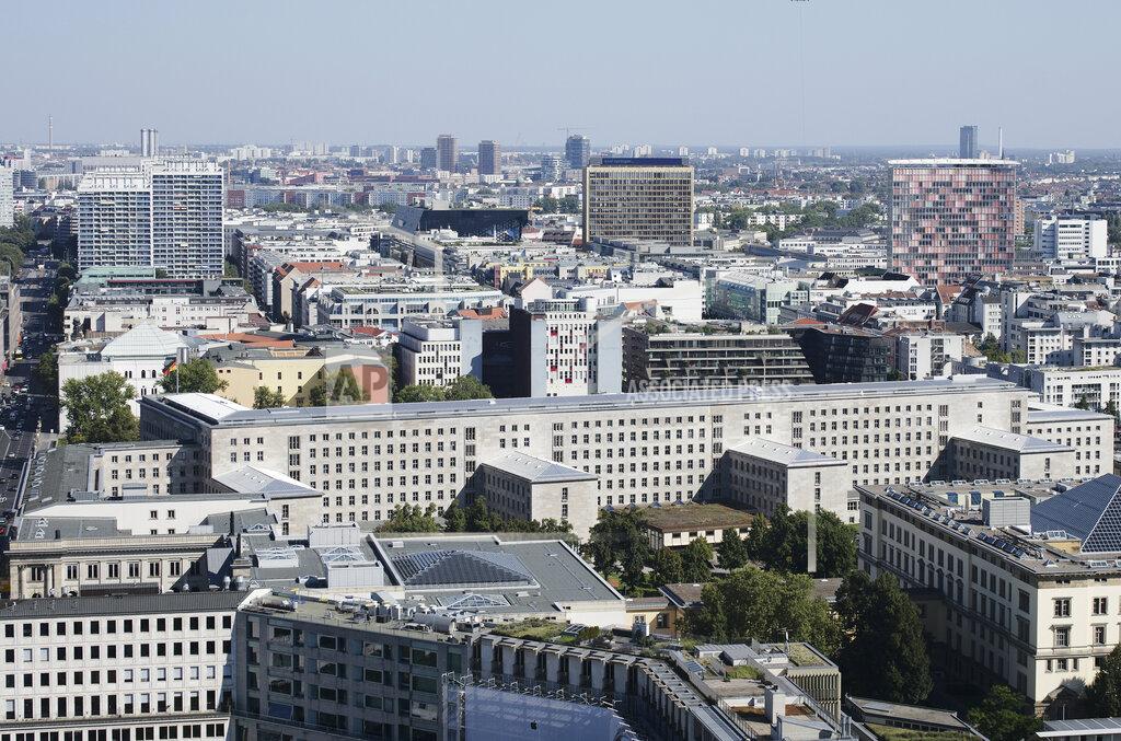 Markus Schreiber Bright sun light shines on the finance ministry, long building center, in Berlin, Germany, Thursday, Sept. 9, 2021. Investigators have carried out searches at the German finance and justice ministries in a probe of suspected obstruction of justice by employees of a unit of the country's customs service that fights money laundering. Word of the searches come just over two weeks ahead of a parliamentary election in which Finance Minister Olaf Scholz is running for chancellor. (AP Photo/Markus Schreiber)