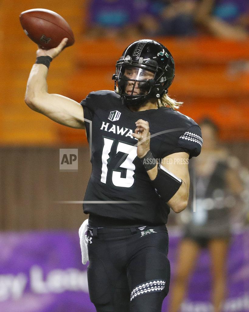 Marco Garcia Hawaii quarterback Cole McDonald (13) makes a pass against Nevada during the fourth quarter at an NCAA college football game Saturday, Oct. 20, 2018, in Honolulu. Nevada defeated Hawaii 40-22. (AP Photo/Marco Garcia)