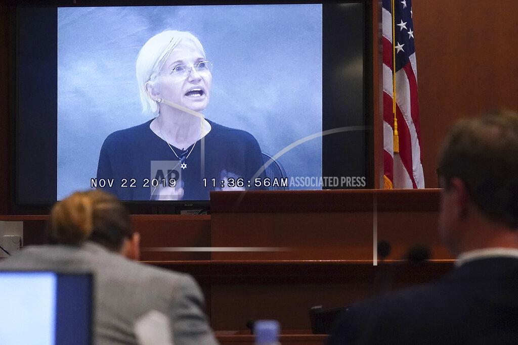 Shaw Thew Actor Ellen Barkin testifies in a previously recorded video deposition at the Fairfax County Circuit Courthouse in Fairfax, Va., Thursday, May 19, 2022. Actor Johnny Depp sued his ex-wife Amber Heard for libel in Fairfax County Circuit Court after she wrote an op-ed piece in The Washington Post in 2018 referring to herself as a "public figure representing domestic abuse." (Shawn Thew/Pool Photo via AP)