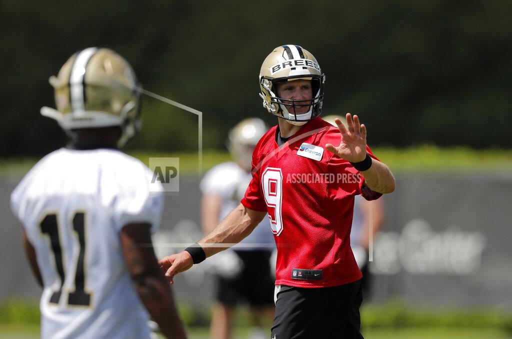 Gerald Herbert New Orleans Saints quarterback Drew Brees (9) works out with rookie wide receiver Deonte Harris during NFL football practice in Metairie, La., Thursday, May 23, 2019. (AP Photo/Gerald Herbert)