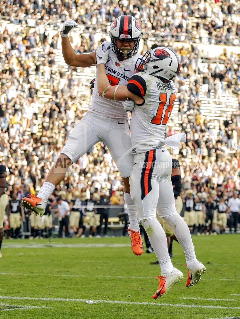 Jack Dempsey Oregon State wide receiver Trevon Bradford (8) celebrates a fourth-quarter touchdown with Timmy Hernandez (18) during an NCAA college football game against Colorado, Saturday, Oct. 27, 2018, in Boulder, Colo. (AP Photo/Jack Dempsey)