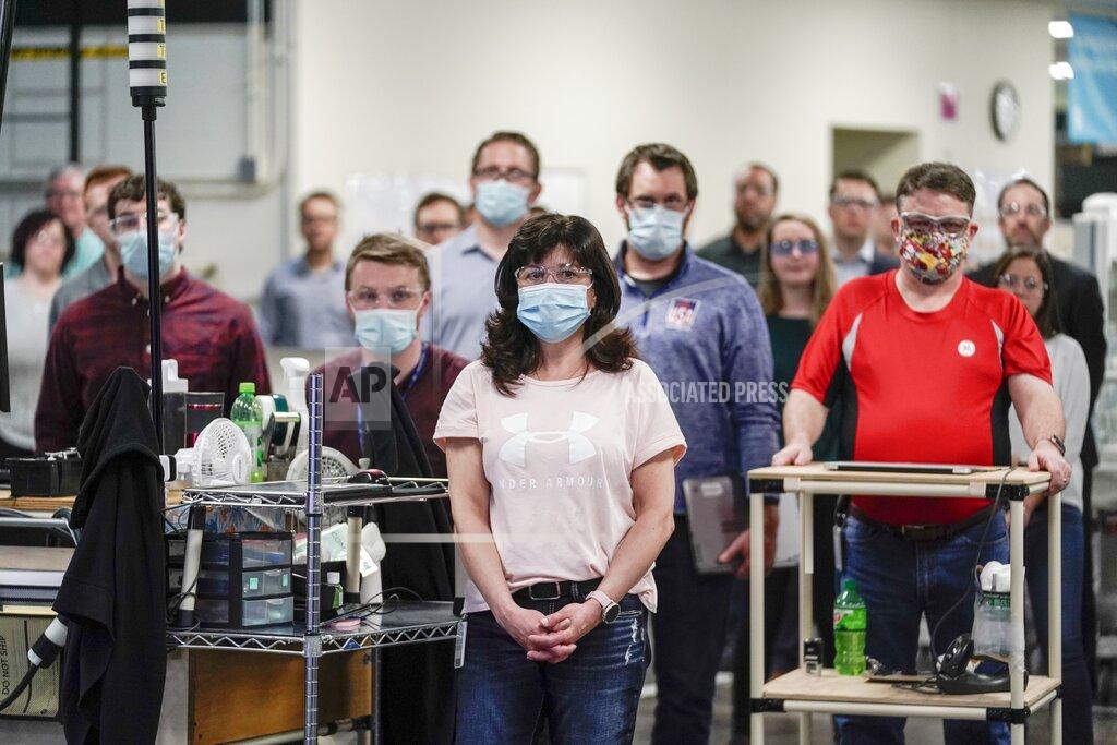 Morry Gash Workers listen as Vice President Mike Pence talks on the PA at the GE Healthcare manufacturing facility Tuesday April 21, 2020, in Madison, Wis. (AP Photo/Morry Gash)