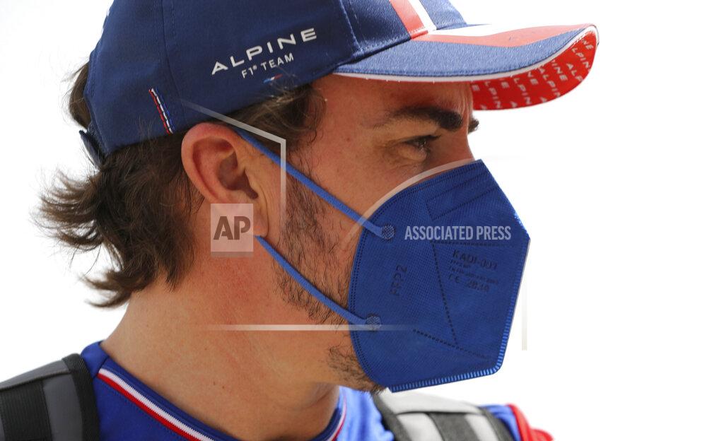 Kamran Jebreili Alpine F1 team driver Fernando Alonso from Spainarrives to the Bahrain International Circuit, in Sakhir, Bahrain, Thursday, March 25, 2021. Bahrain F1 race will be March 28. (AP Photo/Kamran Jebreili)
