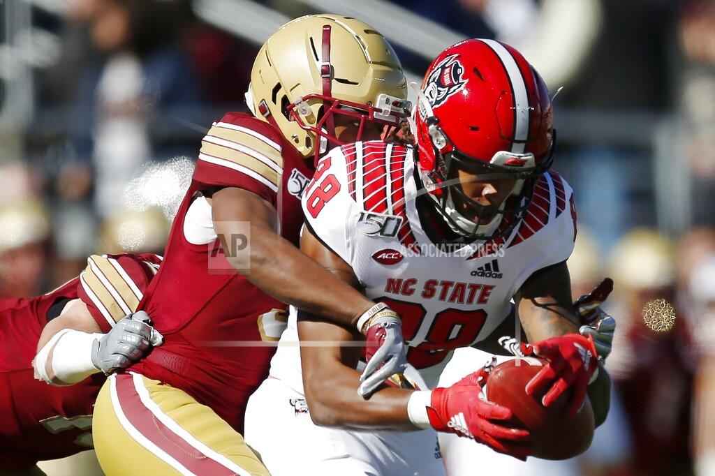 Michael Dwyer Boston College defensive back Jason Maitre, left, tackles North Carolina State wide receiver Devin Carter (88) during the first half of an NCAA college football game in Boston, Saturday, Oct. 19, 2019. (AP Photo/Michael Dwyer)