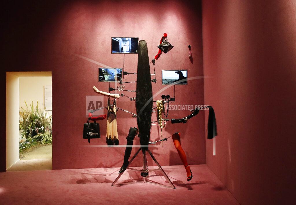 Antonio Calanni A view of a Gucci's advertisement campaign selected for an exhibition to celebrate creative vision of a creative director Alessandro Michele at Gucci Garden Archetypes, in Florence, Italy, Thursday, May 13, 2021. Alessandro Michele has radically shifted Gucci codes and challenged fashion norms in 6 ½ years as creative director at the brand founded by Guccio Gucci as a travel bag company in Florence 100 years ago. To mark the centenary, Michele has curated an exhibit in the brand's shop, restaurant and exhibition space, Gucci Garden, on Florence’s Piazza della Signoria, that underlines some watershed moments: An advertising campaign for perfume featuring a transgender model, an all-Black cast for Pre-Fall 2017 campaign, and a lipstick campaign featuring everyday faces in all their imperfections. (AP Photo/Antonio Calanni)