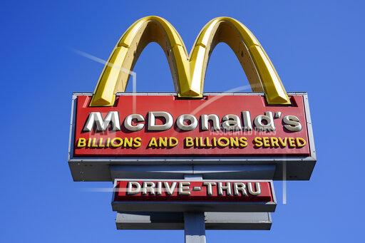 FILE - A McDonald's sign is shown in Philadelphia, Monday, April 26, 2021. McDonald’s reported stronger-than-expected sales in the third quarter, boosted by larger orders and higher prices on the menu. Revenue jumped 14% to $6.2 billion in the July-September period, the Chicago burger giant said Wednesday, Oct. 27, 2021. That beat Wall Street’s forecast of $6 billion, according to analysts polled by FactSet. (AP Photo/Matt Rourke, File)