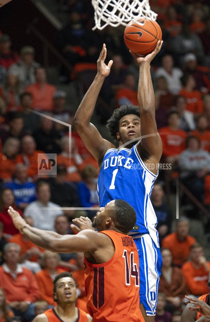 Duke center Vernon Carey Jr. (1) shoots over Virginia Tech forward P.J. Horne (14) during the first half of an NCAA college basketball game Friday, Dec. 6, 2019, in Blacksburg, Va. (AP Photo/Don Petersen)