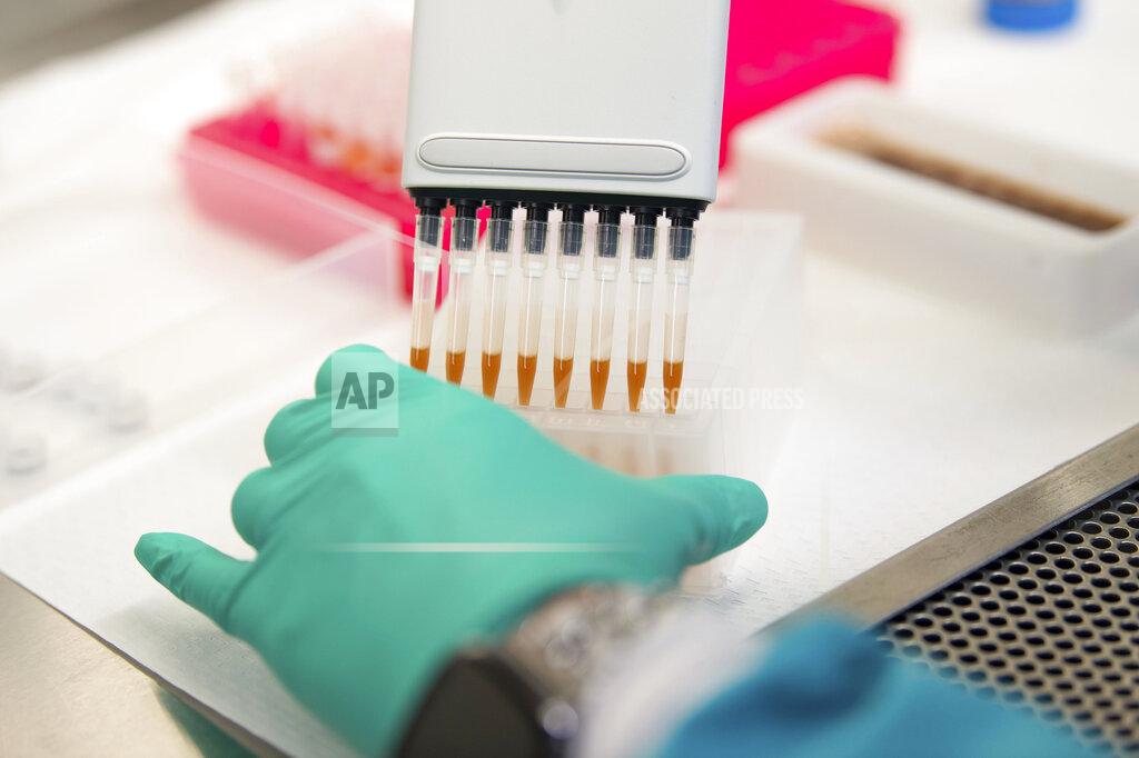 Stephanie Amador Karen Maynard, a laboratory scientist, prepares COVID-19 samples for genome sequencing at the Tennessee public health lab in Nashville, Tenn., Tuesday, Sept. 14, 2021. (Stephanie Amador/The Tennessean via AP)