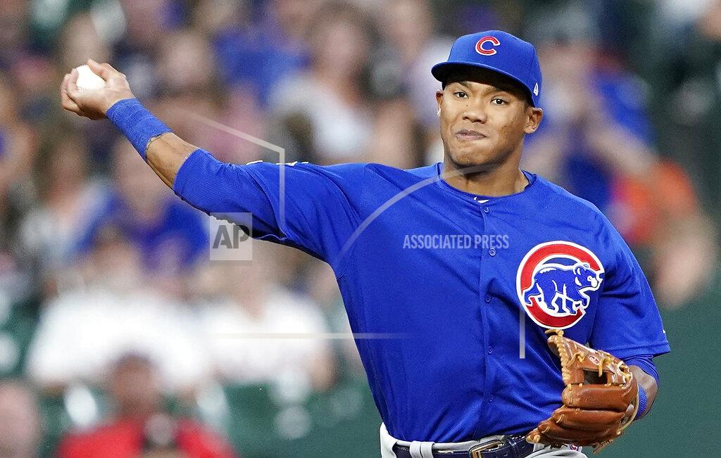 FILE - In this May 29, 2019, file photo, Chicago Cubs shortstop Addison Russell throws to first during the eighth inning of a baseball game against the Houston Astro in Houston. The Cubs failed to offer a 2020 contract to Russell on Monday, Dec. 2, 2019, making the 2016 All-Star a free agent one year after he was suspended for violating Major League Baseball’s domestic violence policy. (AP Photo/David J. Phillip, File)