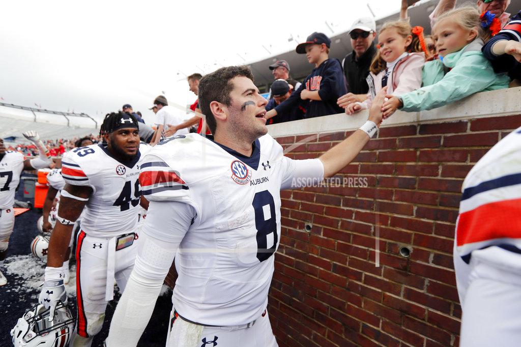 Rogelio V. Solis Auburn quarterback Jarrett Stidham (8) is congratulated by fans following his team's 31-16 win in the NCAA college football game against Mississippi, Saturday, Oct. 20, 2018, in Oxford, Miss. (AP Photo/Rogelio V. Solis)