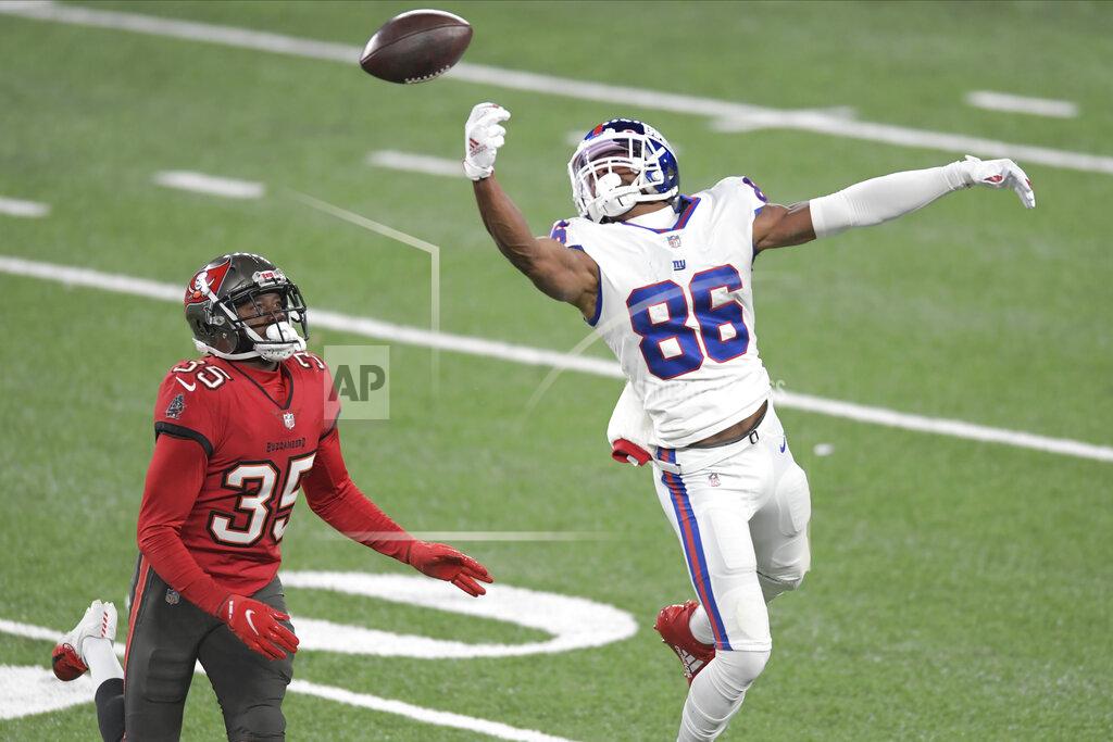 Bill Kostroun New York Giants' Darius Slayton, right, cannot make the catch in front of Tampa Bay Buccaneers' Jamel Dean during the second half of an NFL football game, Monday, Nov. 2, 2020, in East Rutherford, N.J. (AP Photo/Bill Kostroun)