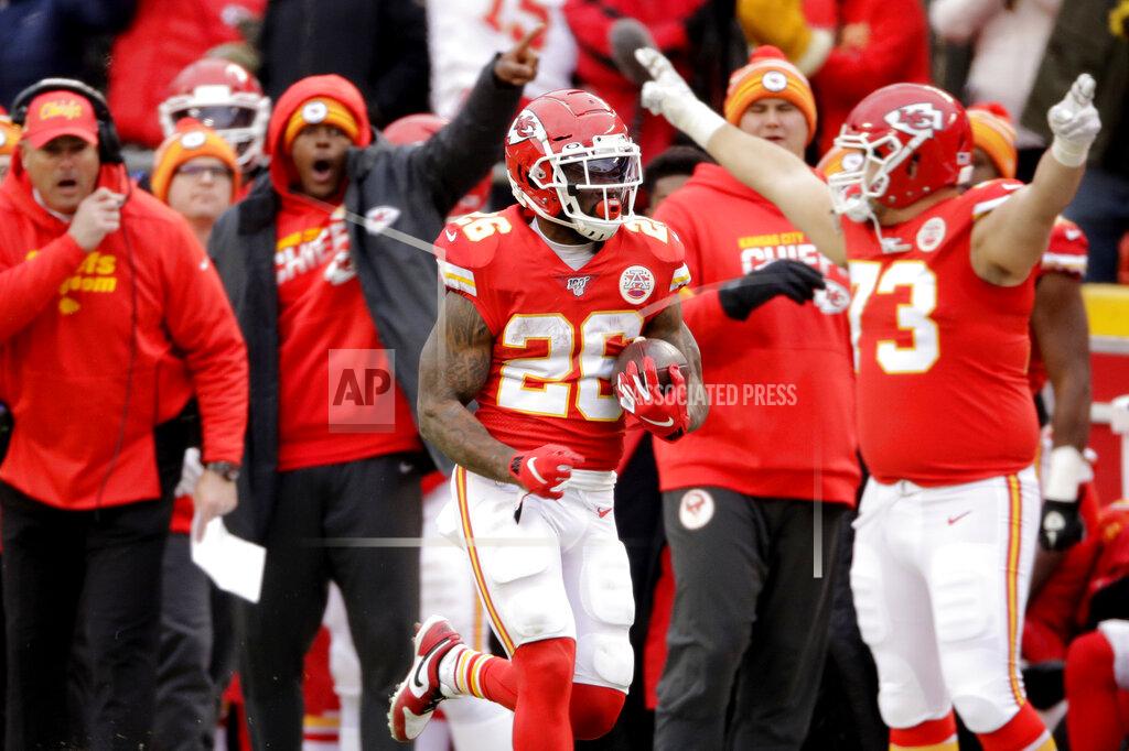 Kansas City Chiefs running back Damien Williams (26) runs for a touchdown during the second half of an NFL football game against the Los Angeles Chargers in Kansas City, Mo., Sunday, Dec. 29, 2019. (AP Photo/Charlie Riedel)