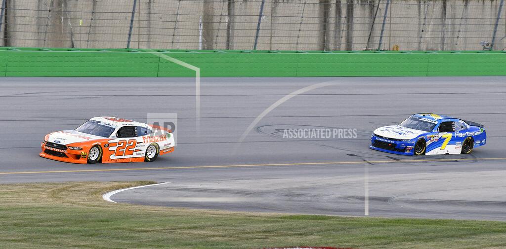 Timothy D. Easley Austin Cindric (22) fights off the challenge from Justin Allgaier (7) during the NASCAR Xfinity Series auto race at Kentucky Speedway in Sparta, Ky., Friday, July 12, 2019. (AP Photo/Timothy D. Easley)