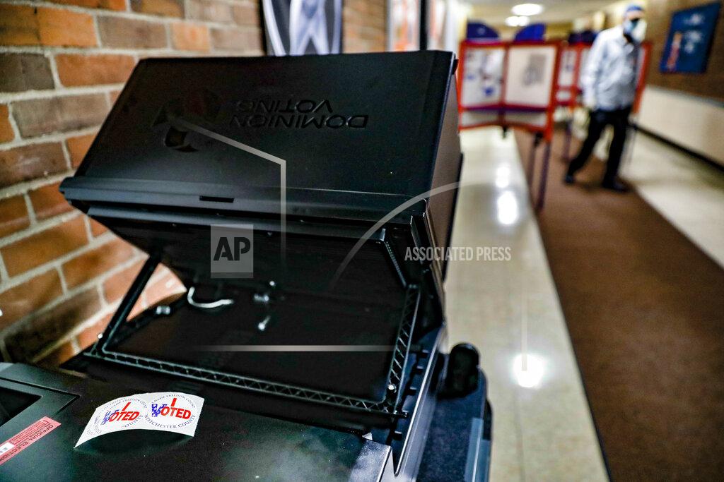 John Minchillo Stickers reading "I Voted" rest on a voting machine set up inside a polling station for New York's primary election at Yonkers Middle/High School, Tuesday, June 23, 2020, in Yonkers, N.Y. (AP Photo/John Minchillo)
