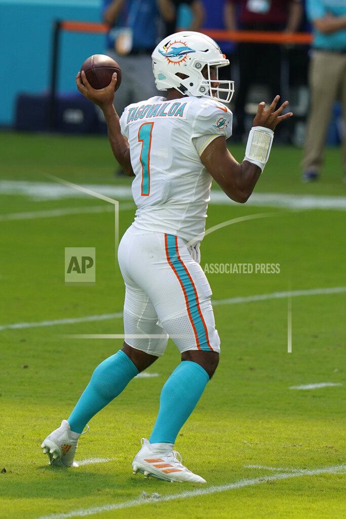 Lynne Sladky Miami Dolphins quarterback Tua Tagovailoa (1) throws his first career touchdown pass, during the first half of an NFL football game against the Los Angeles Rams, Sunday, Nov. 1, 2020, in Miami Gardens, Fla. (AP Photo/Lynne Sladky)
