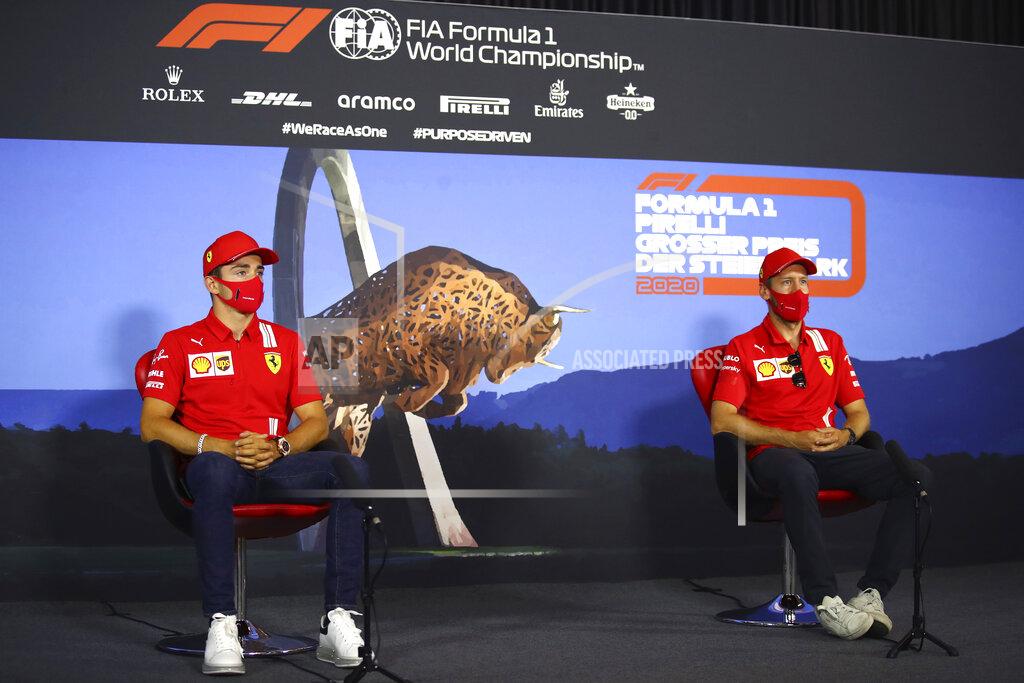 Bryn Lennon Ferrari drivers Sebastian Vettel of Germany, right and Charles Leclerc of Monaco speak during a news conference at the Red Bull Ring racetrack in Spielberg, Austria, Thursday, July 9, 2020. Styrian Formula One Grand Prix will be held on Sunday. (Bryn Lennon/Pool via AP)