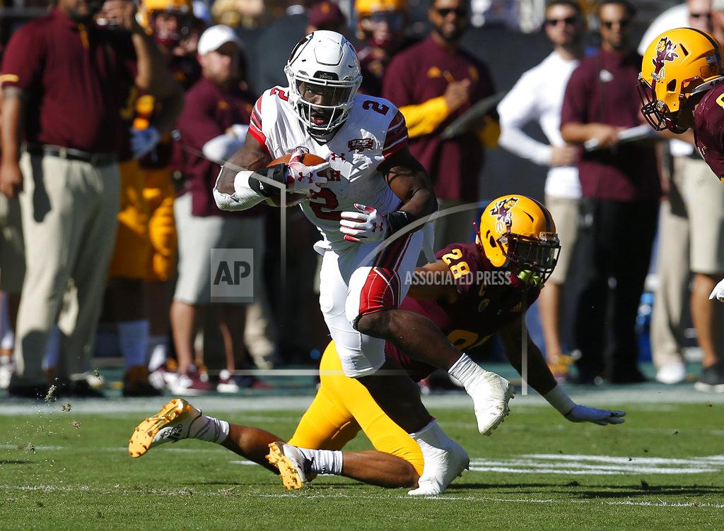 Rick Scuteri Utah running back Zack Moss (2) breaks a tackle by Arizona State defensive back Demonte King in the first half during an NCAA college football game, Saturday, Nov. 3, 2018, in Tempe, Ariz. (AP Photo/Rick Scuteri)