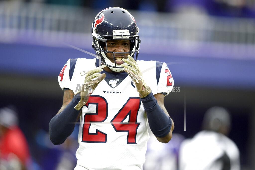 Gail Burton FILE - In this Nov. 17, 2019, file photo, Houston Texans cornerback Johnathan Joseph reacts after giving up a touchdown run to Baltimore Ravens running back Gus Edwards during the second half of an NFL football game in Baltimore. The Tennessee Titans have agreed to terms with veteran cornerback Johnathan Joseph as they continue to revamp their secondary. Joseph, a two-time Pro Bowl selection, has spent the last nine seasons with the Houston Texans after beginning his career with a five-year stint in Cincinnati. (AP Photo/Gail Burton, File)