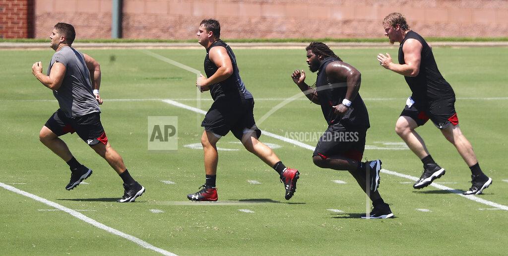 Curtis Compton Atlanta Falcons' Alex Mack, Chris Lindstrom, James Carpenter and Kaleb McGary, from left, run sprints during the NFL football team's strength and conditioning workout Tuesday, Aug. 4, 2020, in Flowery Branch, Ga. (Curtis Compton/Atlanta Journal-Constitution via AP)