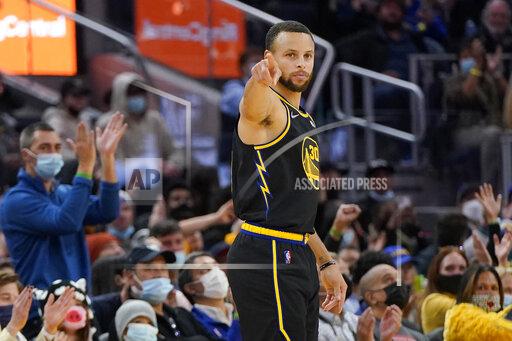 Golden State Warriors guard Stephen Curry gestures after shooting a 3-point basket against the Portland Trail Blazers during the first half of an NBA basketball game in San Francisco, Wednesday, Dec. 8, 2021. (AP Photo/Jeff Chiu)