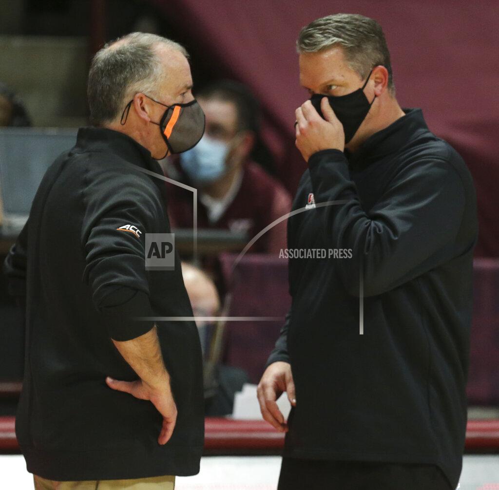 Matt Gentry Virginia Tech head coach Mike Young, left, and VMI head coach Dan Earl talk at the conclusion of an NCAA college basketball game, Thursday, Dec. 3, 2020 in Blacksburg, Va. (Matt Gentry/The Roanoke Times via AP, Pool)