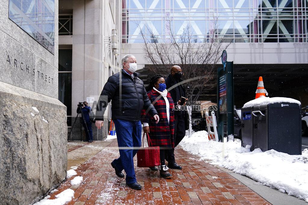 Matt Rourke Philadelphia Mayor Jim Kenney, center left, walks to his vehicle after a news conference and a visit to a COVID-19 vaccination site at the Pennsylvania Convention Center in Philadelphia, Wednesday, Feb. 3, 2021. (AP Photo/Matt Rourke)